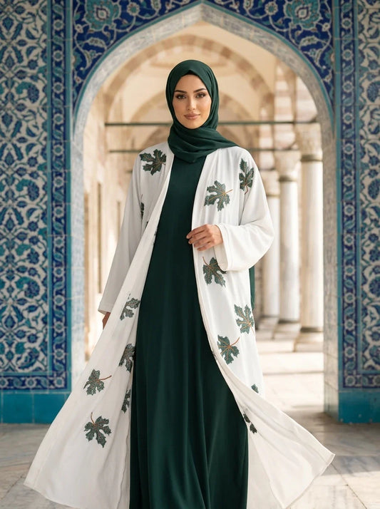 Model wearing white Zimal Abaya, full length view