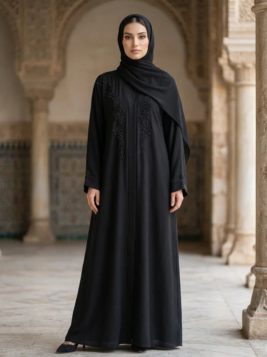 Ayat Abaya in Black — draped cape with beaded floral vine down the chest, front view