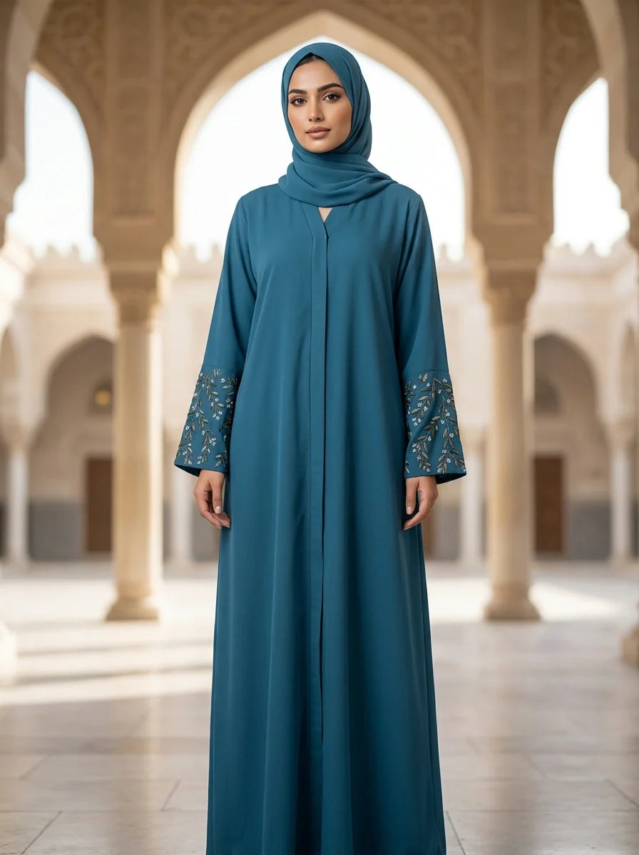 Kanwal Abaya in Teal Blue with hand-embroidered floral cuffs