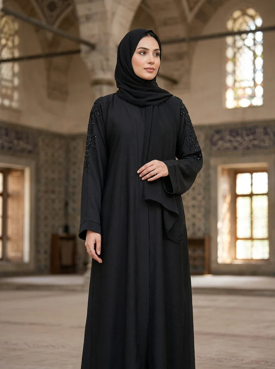 Mehreen Abaya in Black — draped shoulder cape with cascading bead embellishment, front view