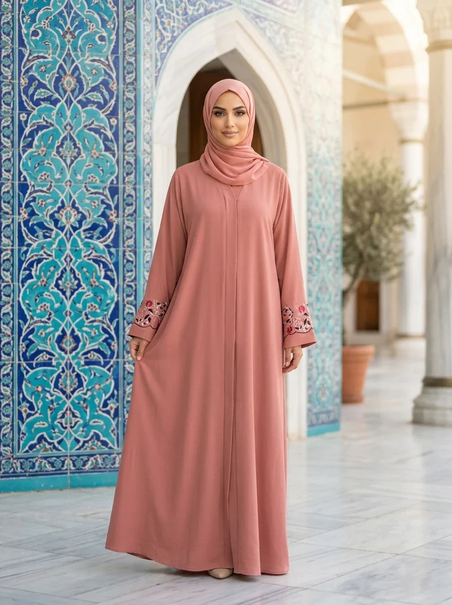 Model wearing Arwa Abaya in pink inside a mosque