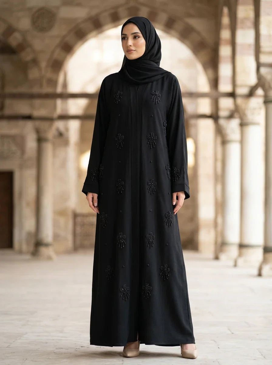Sundas Abaya in Black — cape front with scattered beaded starburst clusters, front view