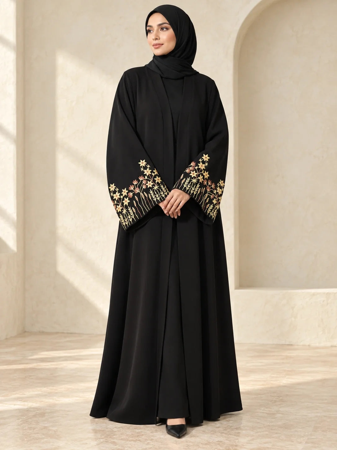 Faiqa Abaya in Black with gold star-flower cuffs