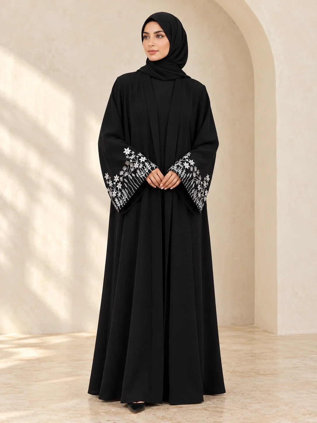 Faiqa Abaya in Black with silver star-flower cuffs