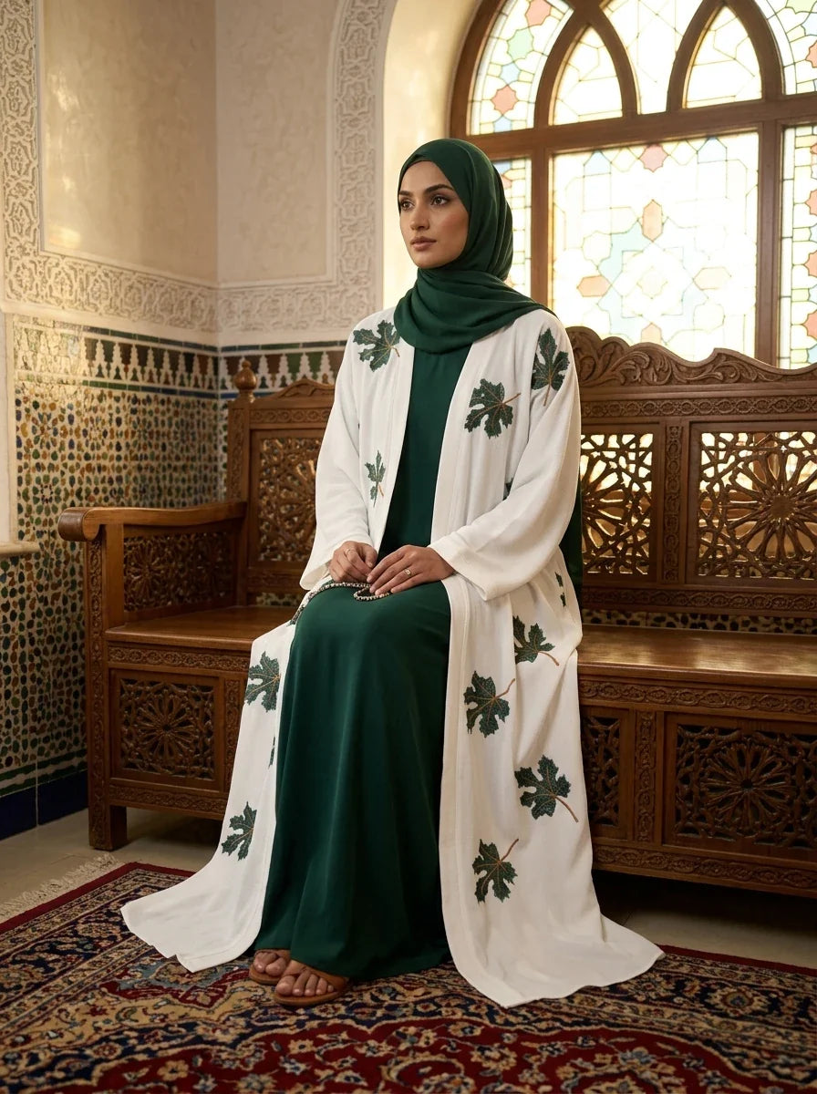 Zimal Abaya in white with 3D floral appliqué and hand-beaded detailing