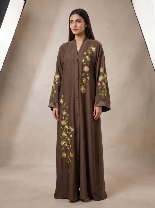 Hiba embroidered brown abaya, 45-degree angle view showing flowing silhouette and sleeve embroidery