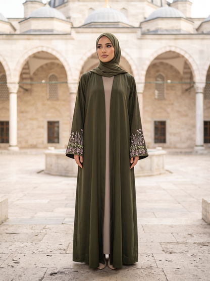 Yasmin olive green abaya, mosque courtyard full-length