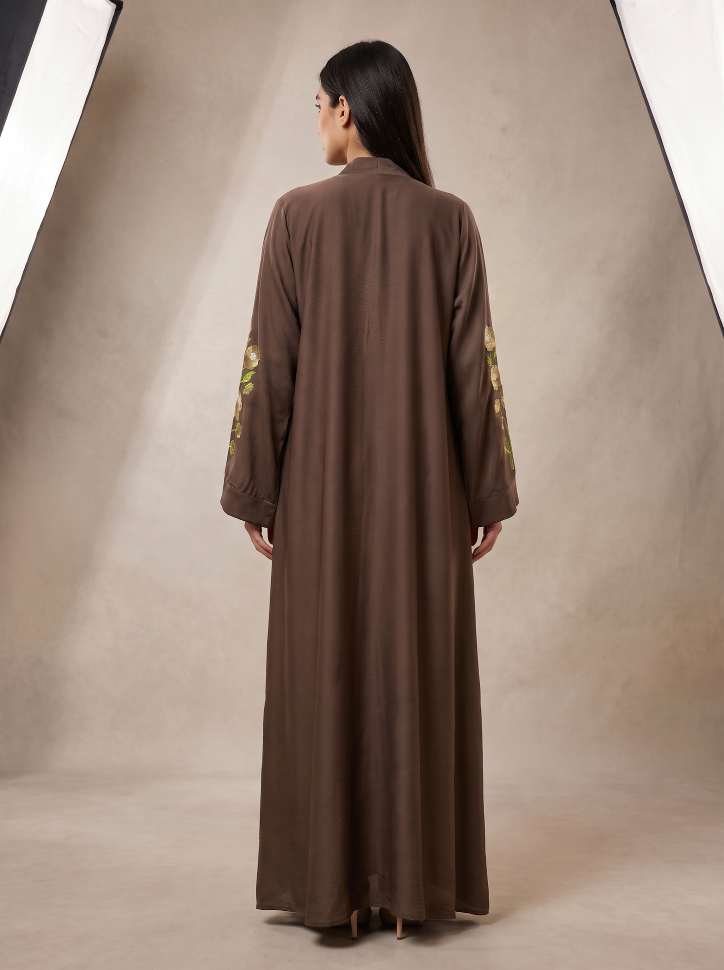 Hiba brown abaya back view showing flowing silhouette and floor-length hem