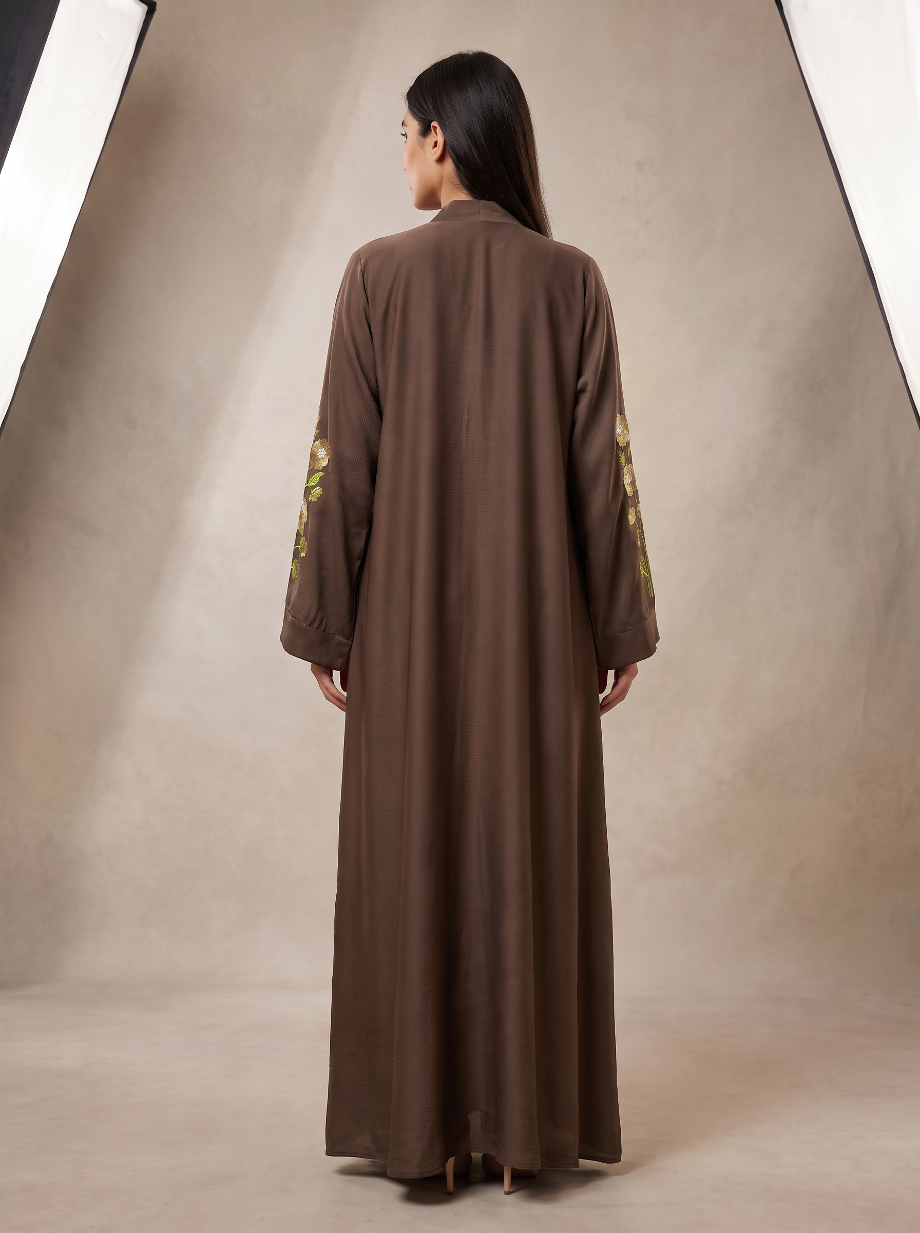 Hiba brown abaya back view showing flowing silhouette and floor-length hem