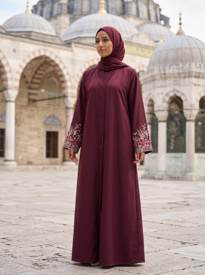 Noor burgundy abaya, mosque courtyard full-length