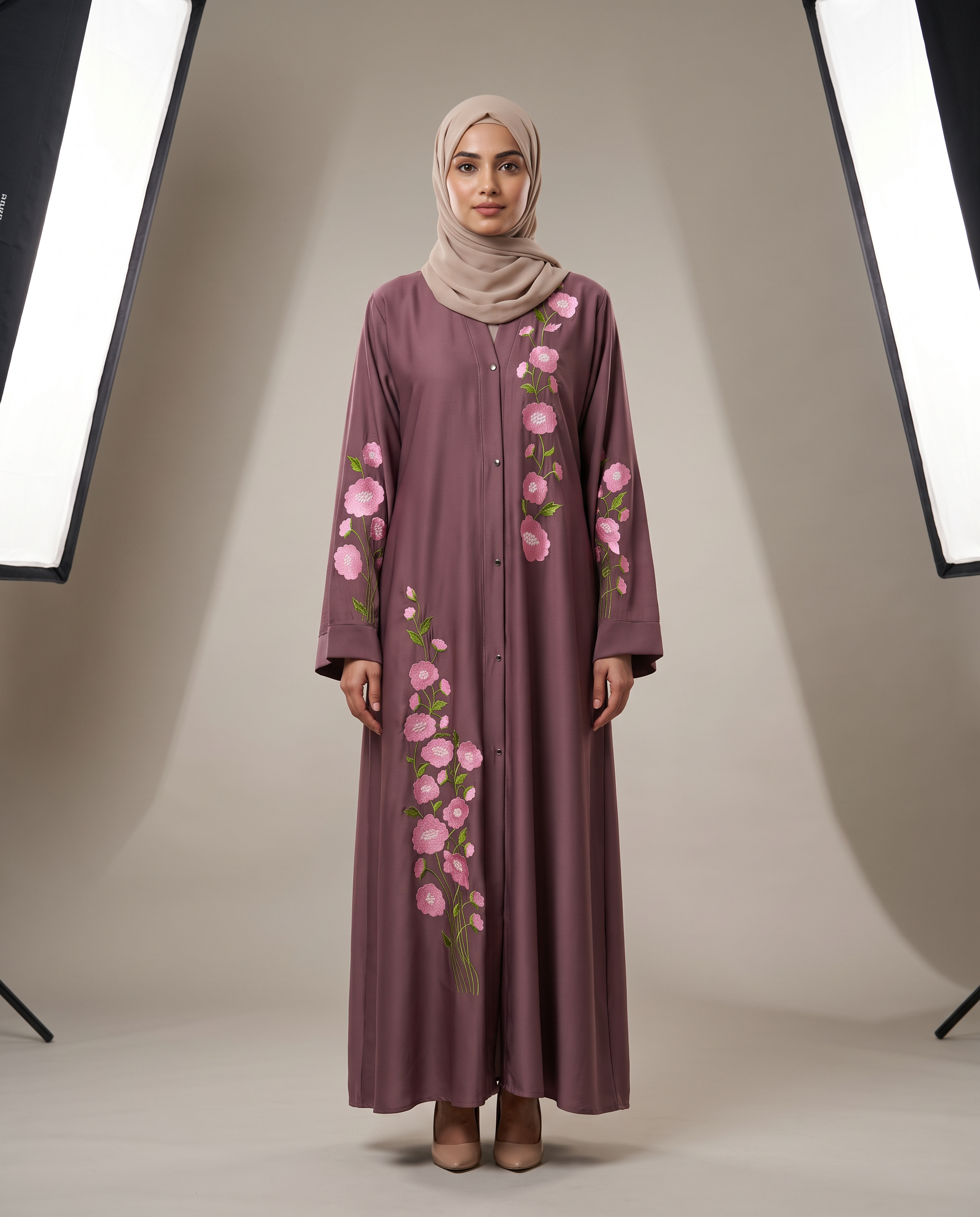 Zainab Embroidered Abaya in mauve Nida fabric, front view on model with pink floral hand embroidery