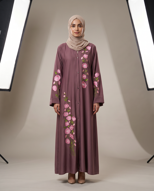 Zainab Embroidered Abaya in mauve Nida fabric, front view on model with pink floral hand embroidery