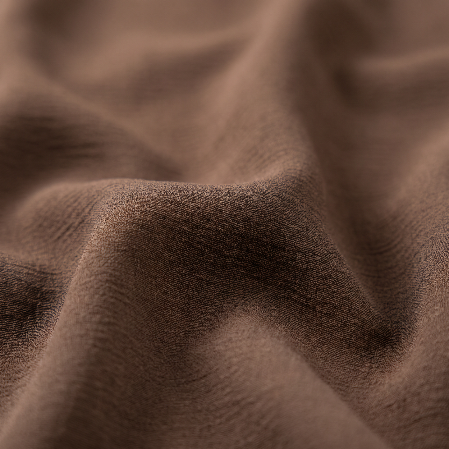 Close-up of mocha brown crepe fabric texture on Hiba abaya